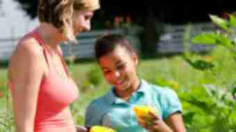 Woman and Child Eating Fruit