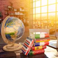 Desk with globe and books for foreign languages.
