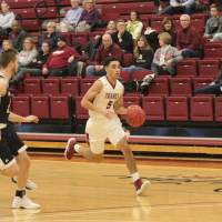Transylvania basketball player drives past opponent